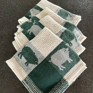 Four kitchen towels. Brand new. Never used. Measuring 12” x 12” square